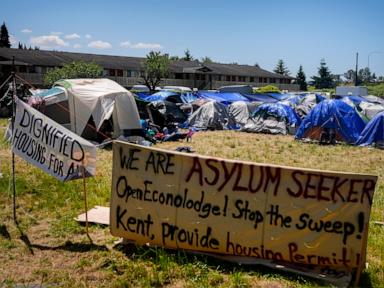 hundreds-of-asylum-seekers-are-camped-out-near-seattle.-there’s-a-vacant-motel-next-door